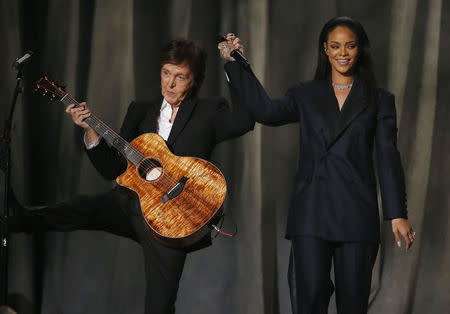 Paul McCartney and Rihanna take a bow after performing "FourFiveSeconds" with Kanye West (not pictured) at the 57th annual Grammy Awards in Los Angeles, California February 8, 2015. REUTERS/Lucy Nicholson