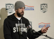 Green Bay Packers quarterback Aaron Rodgers wears a sweatshirt that reads "Butte Strong" in support of the victims of the Camp Fire in Butte County, Calif., as he talks to reporters following the Packers' NFL football game against the Seattle Seahawks, Thursday, Nov. 15, 2018, in Seattle. The Seahawks won 27-24. (AP Photo/Stephen Brashear)