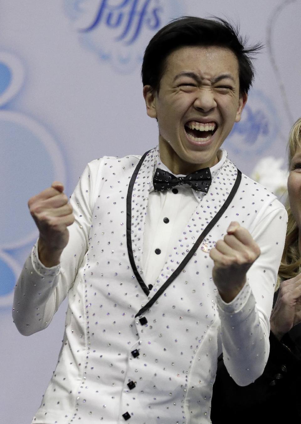 Vincent Zhou reacts after his score was announced in the men's free skate competition at the U.S. Figure Skating Championships, Sunday, Jan. 22, 2017, in Kansas City, Mo. (AP Photo/Charlie Riedel)