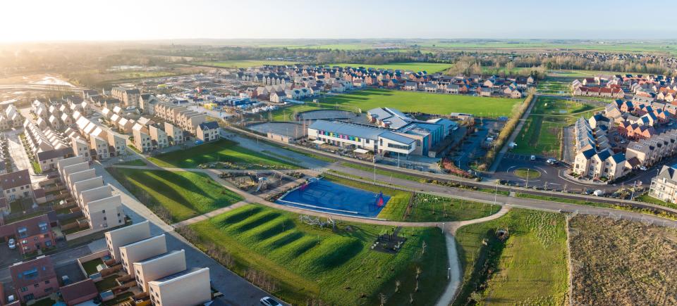 An aerial view of the Northstowe Pathfinder Primary School and public recreational area.