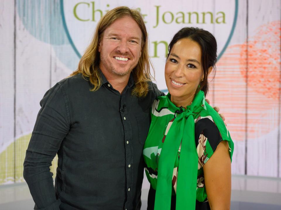 Chip and Joanna Gaines smile for a photo.
