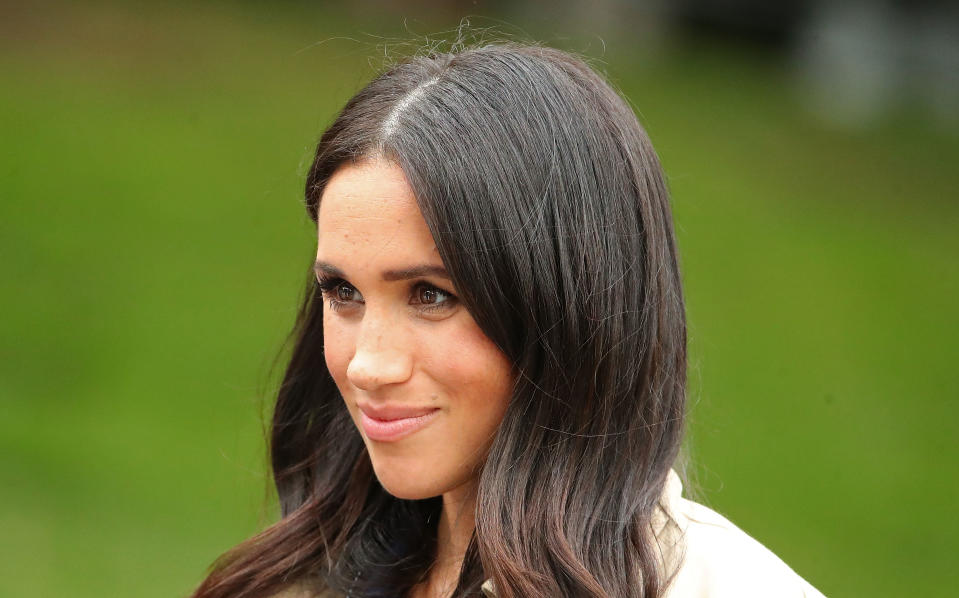 MELBOURNE, AUSTRALIA - OCTOBER 18:  Meghan, Duchess of Sussex looks on as she meets members of the public before attending an official reception at Government House on October 18, 2018 in Melbourne, Australia. The Duke and Duchess of Sussex are on their official 16-day Autumn tour visiting cities in Australia, Fiji, Tonga and New Zealand.  (Photo by Scott Barbour/Getty Images)