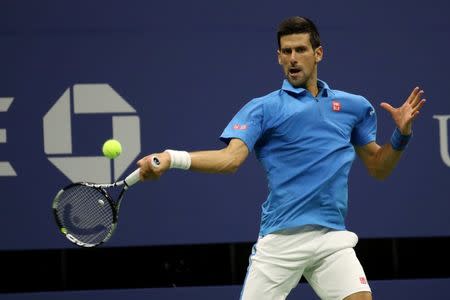 Sep 4, 2016; New York, NY, USA; Novak Djokovic of Serbia hits a forehand against Kyle Edmund of Great Britain (not pictured) on day seven of the 2016 U.S. Open tennis tournament at USTA Billie Jean King National Tennis Center. Mandatory Credit: Geoff Burke-USA TODAY Sports