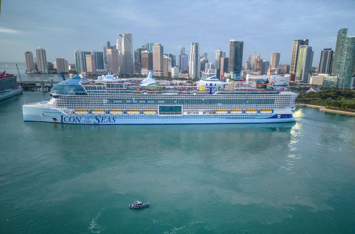 Royal Caribbean’s Icon of the Seas turns around in front of Miami’s skyline.