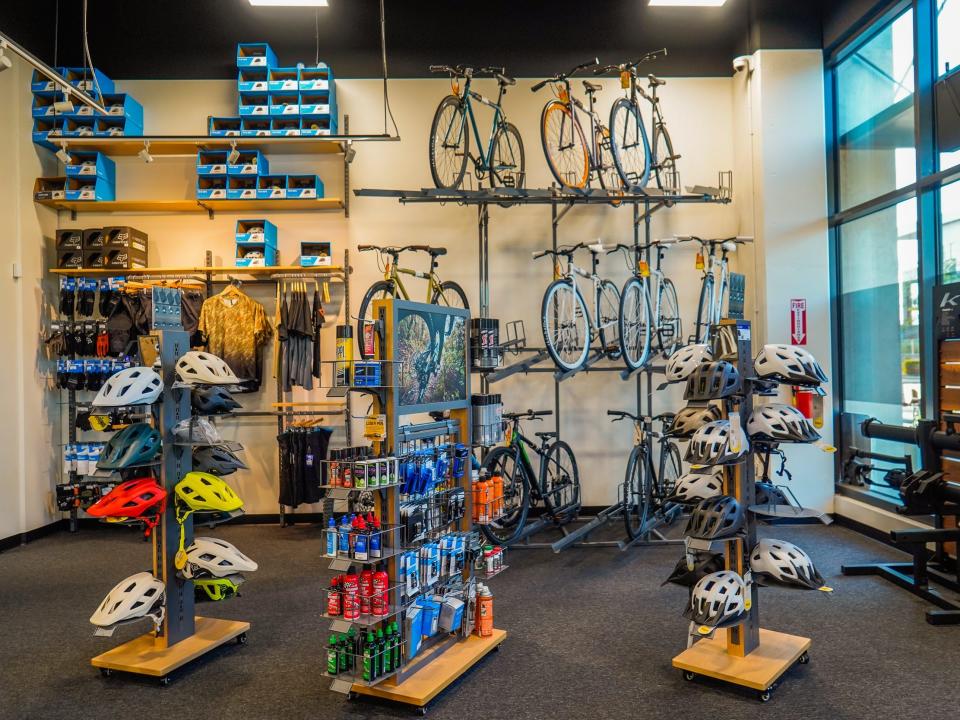 Culdesac Tempe: Inside a bike shop with helmets, bikes, clothing, and other accessories on display