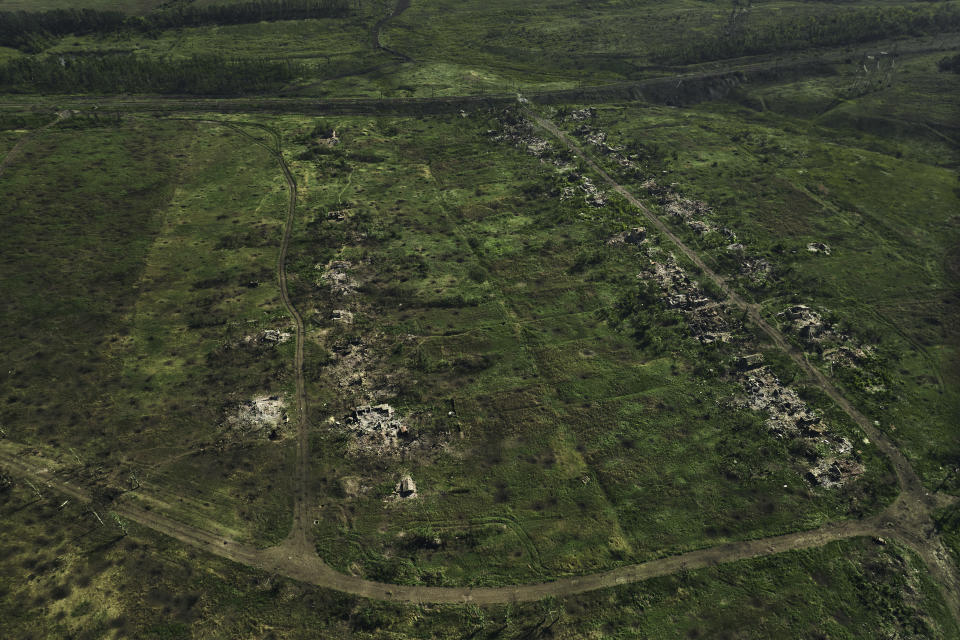 Aerial view of the ruined houses in the destroyed village of Opytne near Bakhmut, the site of fierce battles with the Russian forces in the Donetsk region, Ukraine, Sunday, Sept. 3, 2023. (AP Photo/Libkos)