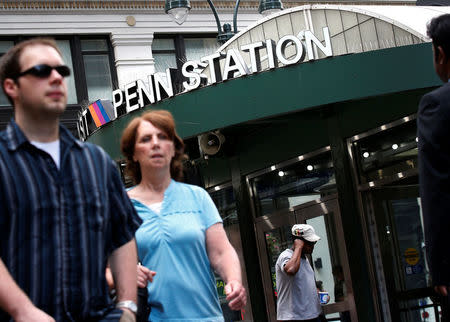 Commuters pass by New York's Pennsylvania Station which began track repairs causing massive disruptions to commuters in New York City, U.S., July 10, 2017. REUTERS/Brendan McDermid