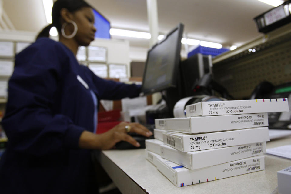 A pharmacist fills orders at Doughery's Pharmacy in Dallas