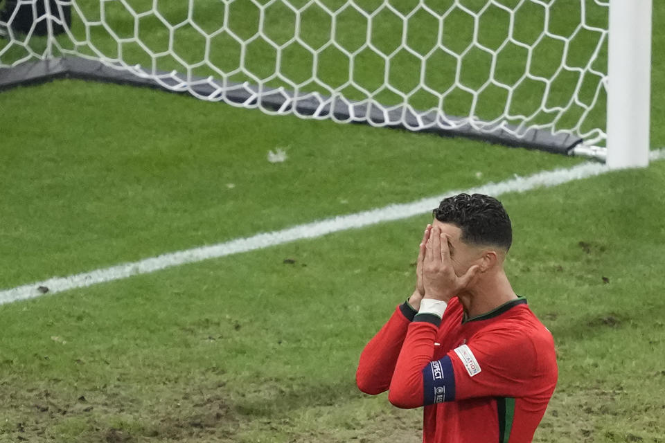 Portugal's Cristiano Ronaldo reacts after missing a chance to score a goal against Slovenia during a round of sixteen match between Portugal and Slovenia at the Euro 2024 soccer tournament in Frankfurt, Germany, Monday, July 1, 2024. (AP Photo/Michael Probst)