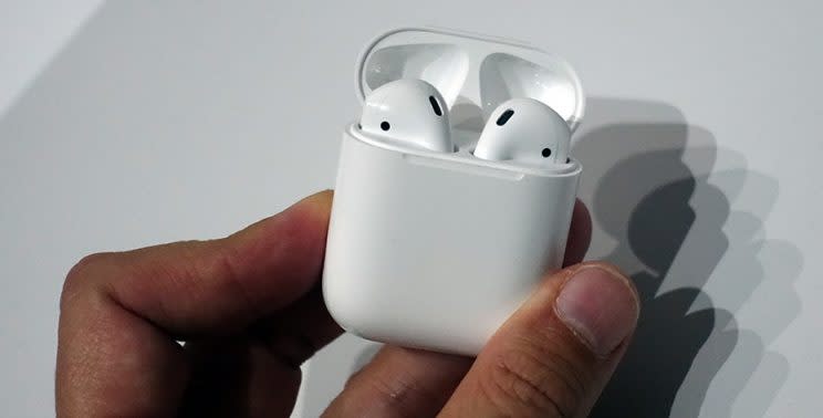 The Airpods in their charging case.