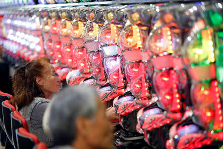 Visitors play pachinko, a Japanese form of legal gambling, at a pachinko parlour in Fukushima, Japan, May 24, 2018. Picture taken May 24, 2018. REUTERS/Issei Kato