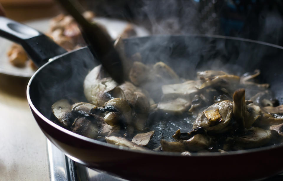 Cooking mushrooms in a skillet.