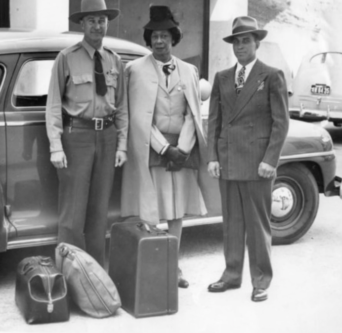 Lucy standing in between two men