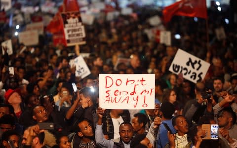 Mr Netanyahu's original plan sparked widespread protests in Israel. - Credit: AP Photo/Ariel Schalit, File