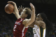 Texas Tech guard Sydney Goodson, left, grabs a rebound over Baylor center Queen Egbo, right, in the first half of an NCAA college basketball game, Saturday, Jan. 25, 2020, in Waco Texas. (AP Photo/Rod Aydelotte)