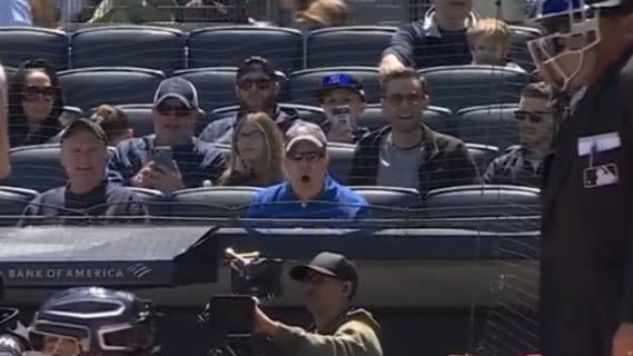 A screaming fan from the stands causes Aaron Boone to be sent off the field