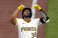 Pittsburgh Pirates' Edward Olivares celebrates as he crosses home plate after hitting a grand slam off Los Angeles Angels starting pitcher Tyler Anderson during the third inning of a baseball game in Pittsburgh, Monday, May 6, 2024. (AP Photo/Gene J. Puskar)