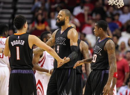 Apr 7, 2016; Houston, TX, USA; Phoenix Suns center Tyson Chandler (4) celebrates with teammates after a play during the third quarter against the Houston Rockets at Toyota Center. Mandatory Credit: Troy Taormina-USA TODAY Sports