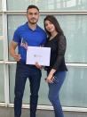 In this September 2019, photo provided by Jad "Jay" Jawad, Jawad, left, who came to the U.S. as a refugee from war-torn Iraq, poses at his naturalization ceremony in Phoenix with his wife, Nagham Rabeea, right. Jawad's parents and siblings are also settled in Arizona. He said that during presidential elections in his native country, Saddam Hussein was the only candidate on the ballot and the only real option was "yes," because a "no" vote could get you jailed or worse. Now, he said he is looking to voting freely in his first U.S. presidential election this fall. (Jad "Jay" Jawad via AP)