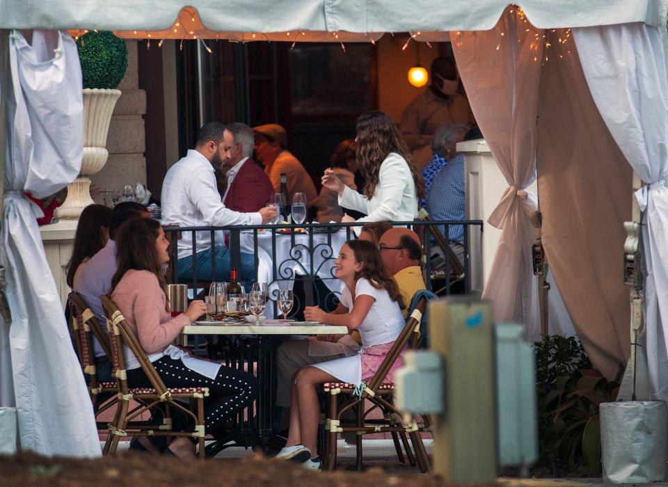 People dine at Pistache on Clematis Street in downtown West Palm Beach.