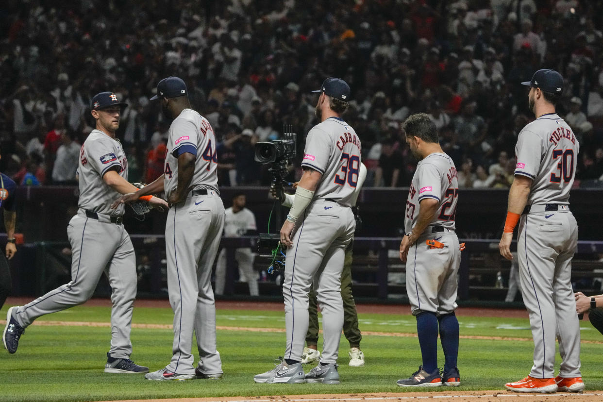 Houston Astros players celebrate after defeating the Colorado Rockies 12-4 during a baseball game at Alfredo Harp Helu stadium in Mexico City, Saturday, April 27, 2024. (AP Photo/Fernando Llano)