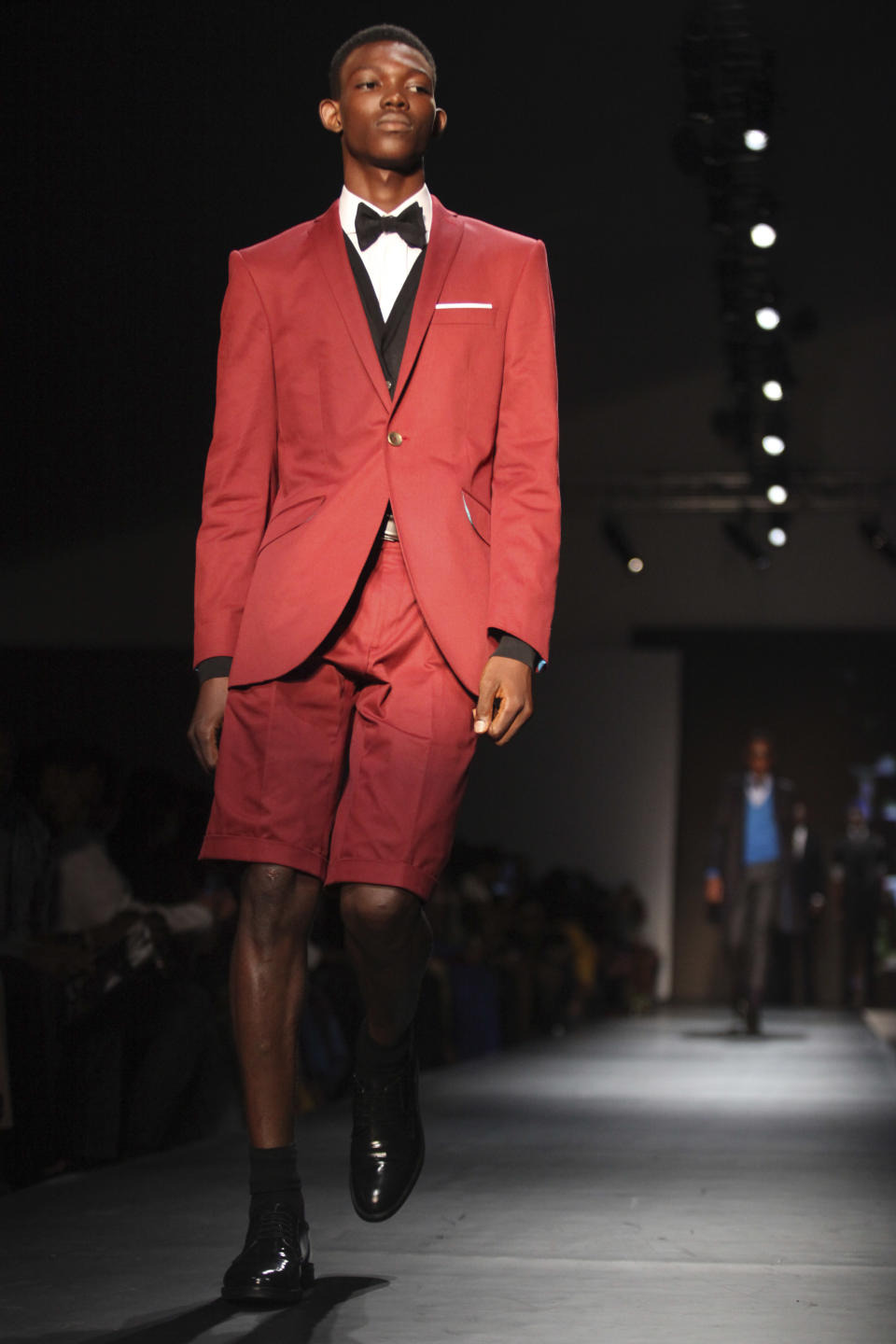 A model displays an outfit by designer Ozwald Boateng of the United Kingdom at the ARISE Fashion Week event in Lagos, Nigeria on Sunday, March 11, 2012. (AP Photos/Sunday Alamba)