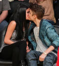 <p>LOS ANGELES, CA – APRIL 17: Selena Gomez (L) and Justin Bieber kiss at a basketball game between the San Antonio Spurs and the Los Angeles Lakers at Staples Center on April 17, 2012 in Los Angeles, California. (Photo by Noel Vasquez/Getty Images) </p>