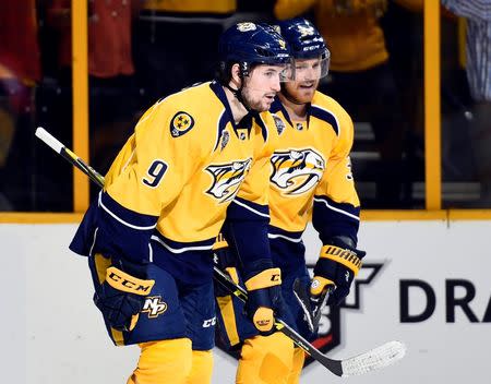 Nashville Predators left winger Filip Forsberg (9) celebrates with left winger Colin Wilson (33) after a goal during the third period against the San Jose Sharks in game three of the second round of the 2016 Stanley Cup Playoffs at Bridgestone Arena. Mandatory Credit: Christopher Hanewinckel-USA TODAY Sports