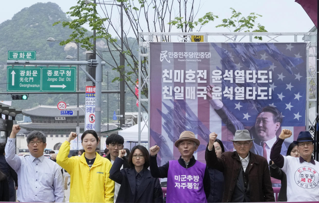 Protesters with a banner showing an image of South Korean President Yoon Suk Yeol stage a rally to denounce policies of the United States and South Korea on North Korea near the U.S. Embassy in Seoul, South Korea, Friday, April 21, 2023. North Korea's foreign minister on Friday called the Group of Seven wealthy democracies a "tool for ensuring the U.S. hegemony" as she lambasted the group's recent call for the North's denuclearization. (AP Photo/Ahn Young-joon)