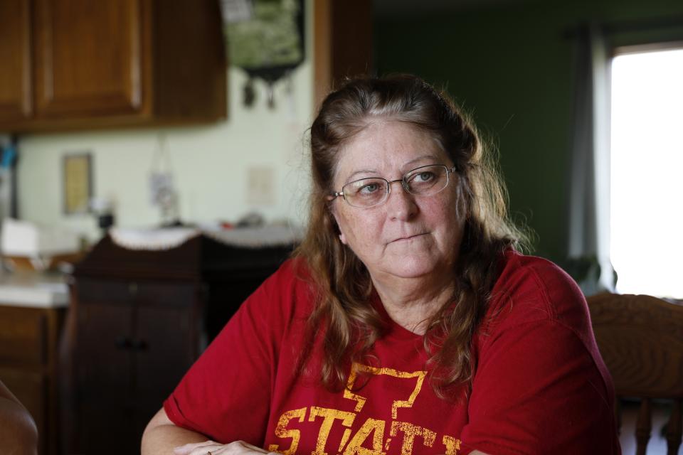 In this Oct. 29, 2018, photo, Gail Schwartzkopf, of Rudd, Iowa, talks about the concentrated animal feeding operation, or CAFO, built near her home in Rudd, Iowa. Jeff and Gail Schwartzkopf say their lives changed drastically after a hog operation was built a quarter-mile from their home in northern Iowa. (AP Photo/Charlie Neibergall)