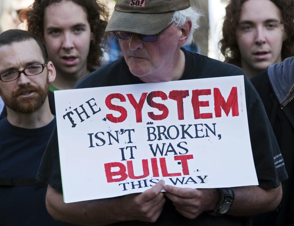 Demonstrators gather in the Grand Parade in Halifax, Nova Scotia, Canada on Saturday, Oct. 15, 2011. The demonstration is one of many being held across the country recently in support of the ongoing Occupy Wall Street demonstration in New York. (AP Photo/The Canadian Press, Andrew Vaughan)