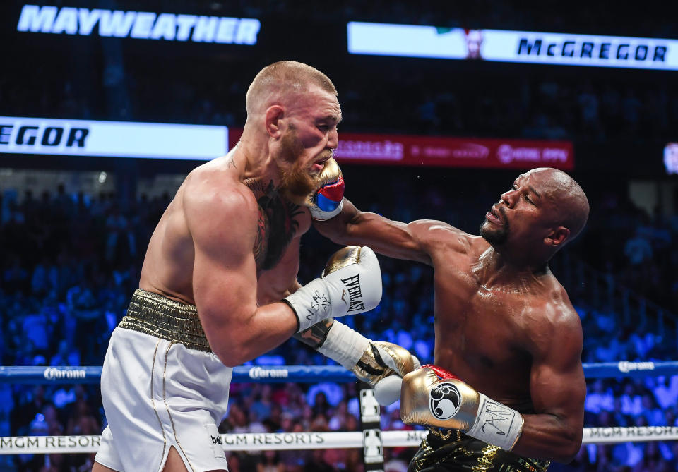 Nevada , United States - 26 August 2017; Floyd Mayweather Jr, right, and Conor McGregor during their super welterweight boxing match at T-Mobile Arena in Las Vegas, USA. (Photo By Stephen McCarthy/Sportsfile via Getty Images)