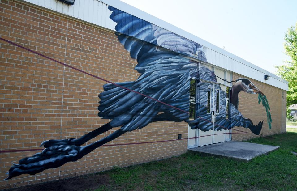 Renowned Detroit-area artist Bakpack Durden painted this large blue heron on the brick wall outside of Orchard Center High School in Monroe last summer as part of the inaugural year of the Plntng Seeds initiative.