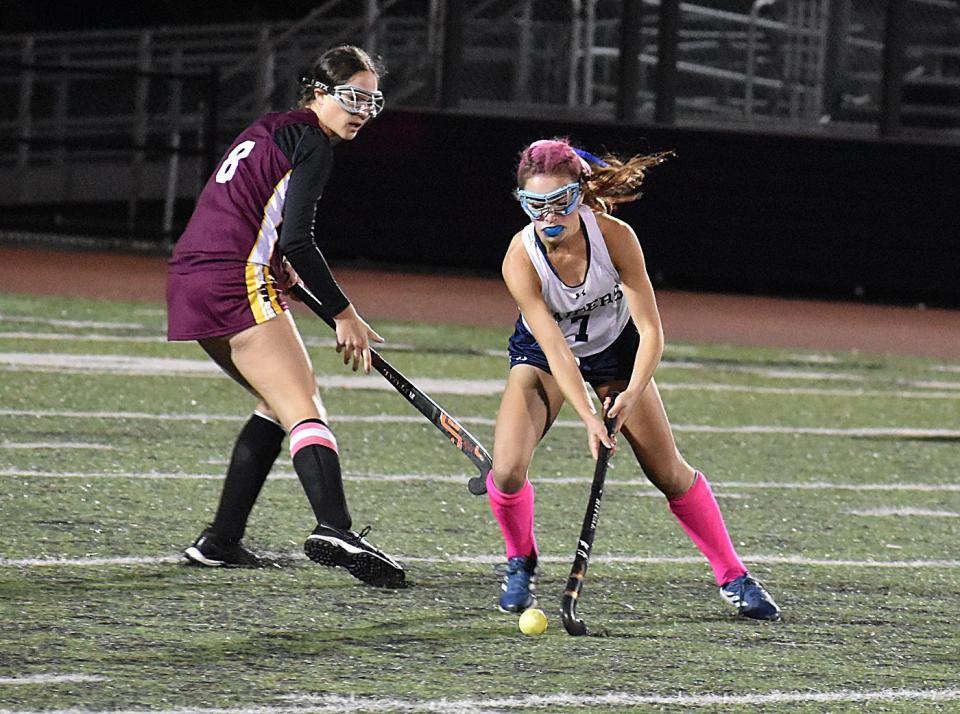 Case's Kaelyn Lecomte (8), left, and Somerset Berkley's Ava Pontes (7) battle for the ball in a recent field hockey game. Pontes scored the game winner in overtime against Westfield on Sunday.