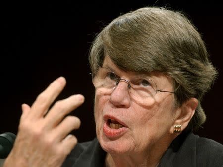 Former U.S. Attorney General Janet Reno testifies before the 9-11 commission in the Hart Senate office building on Capitol Hill in Washington April 13, 2004. REUTERS/Jonathan Ernst MR/JDP