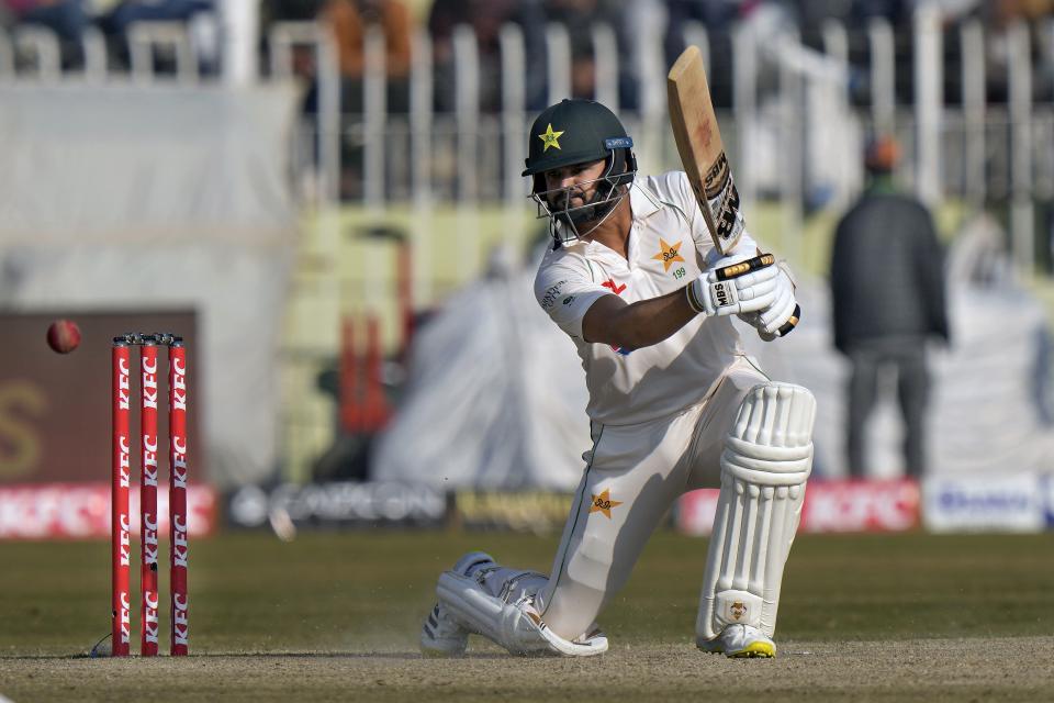 Pakistan's Azhar Ali plays a shot during the fifth day of the first test cricket match between Pakistan and England, in Rawalpindi, Pakistan, Monday, Dec. 5, 2022. (AP Photo/Anjum Naveed)