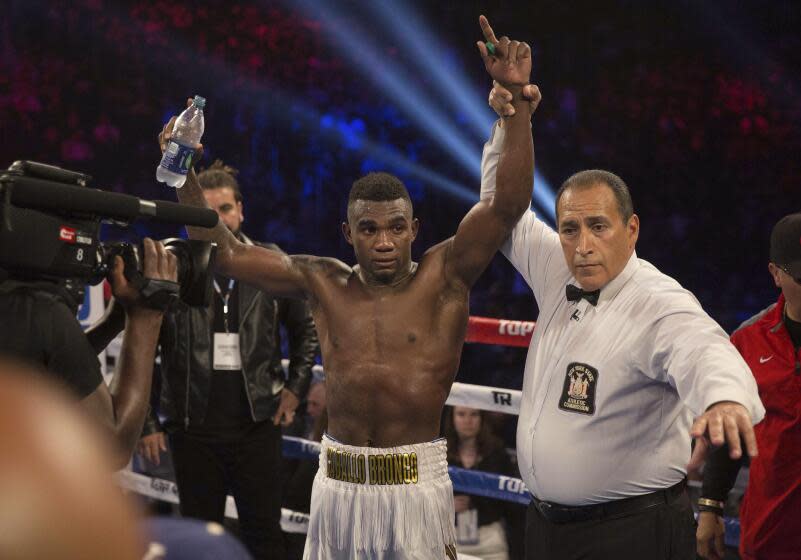 Carlos Adames, of the Dominican Republic, celebrates his victory against Alejandro Barrera, of Mexico, in their welterweight boxing match Saturday, May 12, 2018, in New York. (AP Photo/Kevin Hagen)