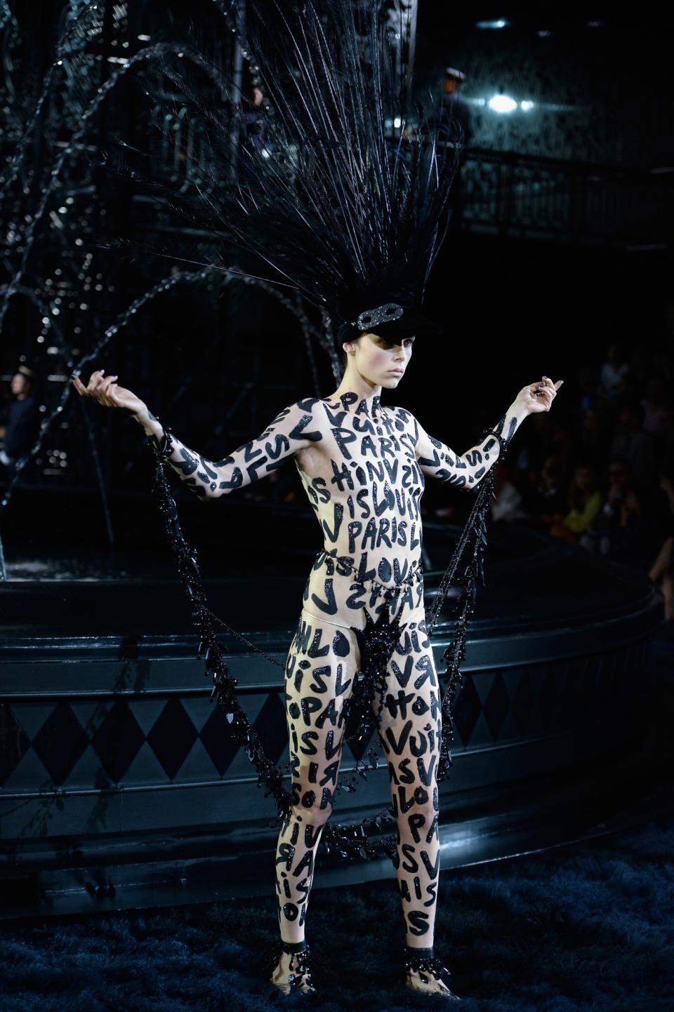 <p>Sixteen years after he took the prime position at Louis Vuitton, Marc Jacobs bid farewell to the house with a tribute to his previous collections. Painting everything black, the show turned into a kind of funeral with Edie Campbell as the showgirl. <i>[Photo: Getty]</i> </p>