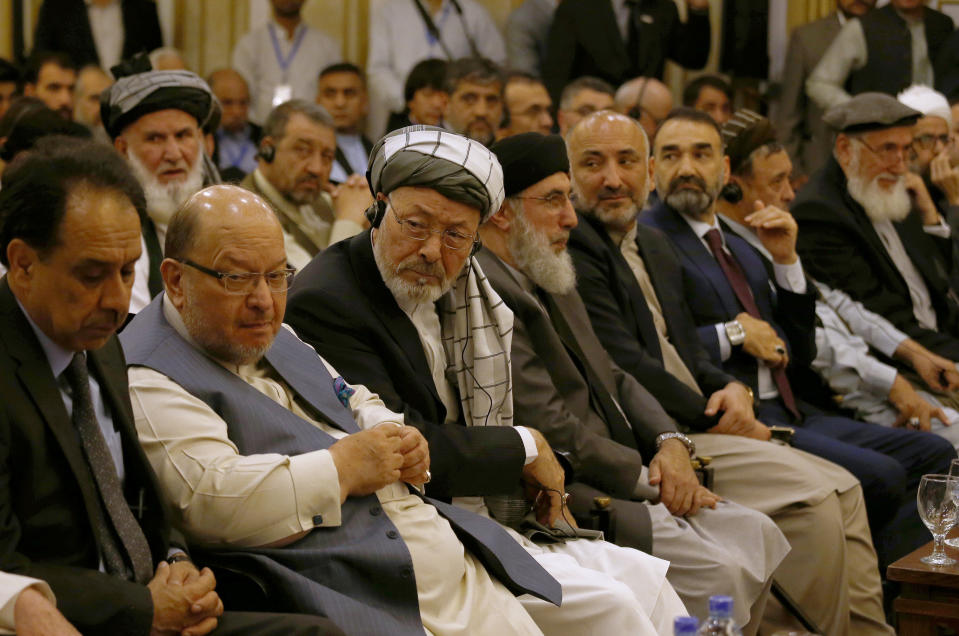 Mohammad Karim Khalili, third left, head of the Afghan High Peace Council, and other Afghan politicians attend the opening session of an Afghan Peace Conference in Bhurban, 65 kilometers (40 miles) north of Islamabad, Pakistan, Saturday, June 22, 2019. Dozens of Afghan political leaders attended a peace conference in neighboring Pakistan on Saturday to pave the way for further Afghan-to-Afghan dialogue. (AP Photo/Anjum Naveed)