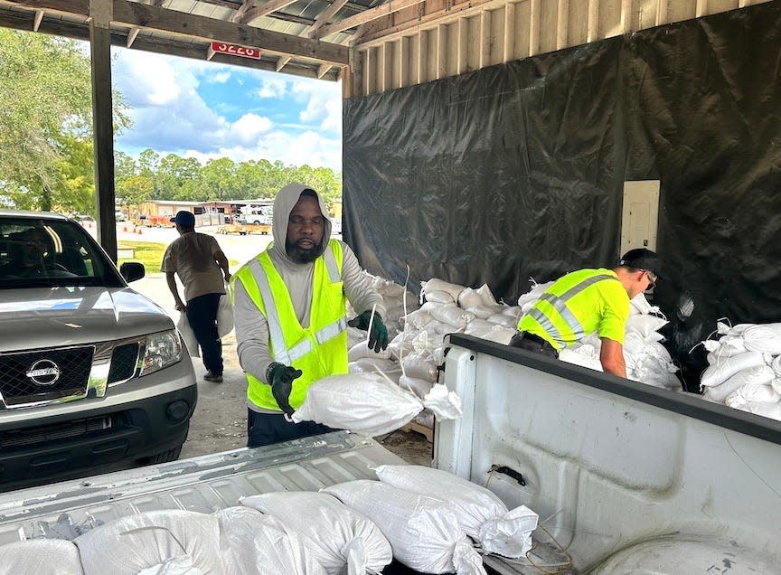 Employees with Gainesville Public Works, 405 NW 39th Ave., load sandbags for residents on Monday afternoon ahead of the arrival of Hurricane Idalia. Sandbags will be available again Tuesday from 9 a.m. to 3 p.m.