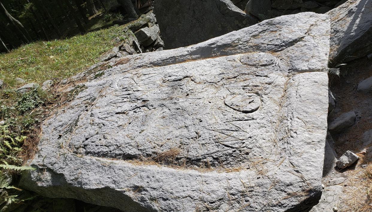 This photo released Oct. 3, 2019, by the Salem, N.H. Police Department shows vandalism to a stone in group of rock configurations called "America's Stonehenge" in Salem, N.H. 