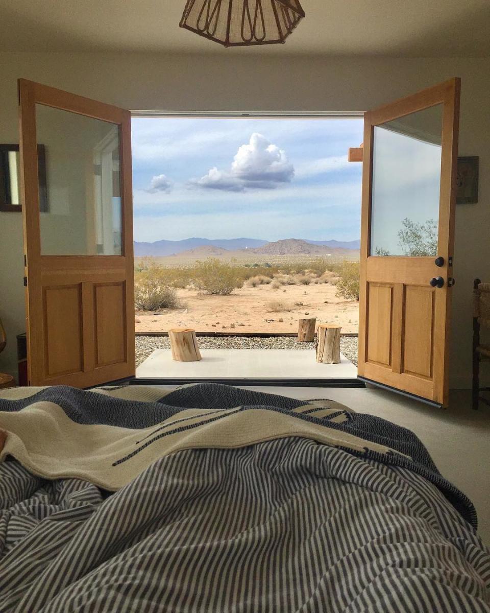 <p>In fourth place, is a 1950s renovated cabin which sits on over 22 acres of impressive land in Joshua Tree, California. Fancy having your morning brew with that for a backdrop, eh? <em>[Photo: Airbnb]</em> </p>