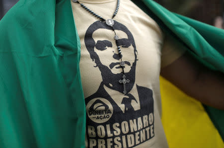 A man wearing a T-shirt depicting Brazil's President Jair Bolsonaro takes part in a pro-government demonstration near Copacabana beach in Rio de Janeiro, Brazil May 26, 2019. REUTERS/Ricardo Moraes