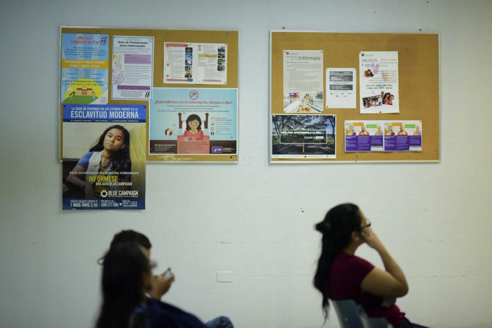 Puerto Rican citizens wait their turn at the Department of Family Affairs, in Bayamon, Puerto Rico, Friday, March 29, 2019. Hundreds of thousands of Puerto Ricans are feeling the sting of what the territorial government says are insufficient federal funds to help the island recover from the Category 4 storm amid a 12-year recession. (AP Photo/Carlos Giusti)