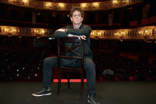 Reed poses on the stage of the Odeon theater in Paris in 1997, just before reading his poems in the show, "The music of city and time"