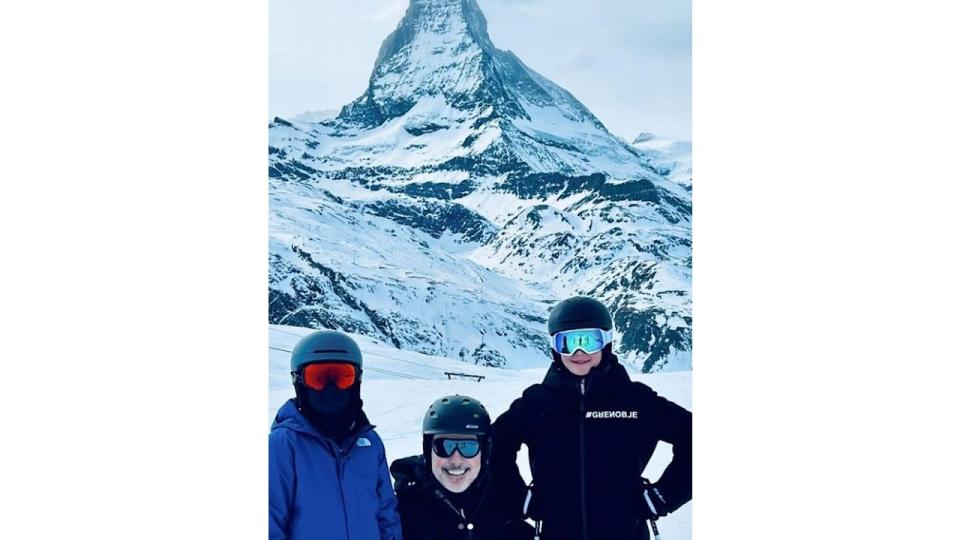 David Furnish with his sons skiing