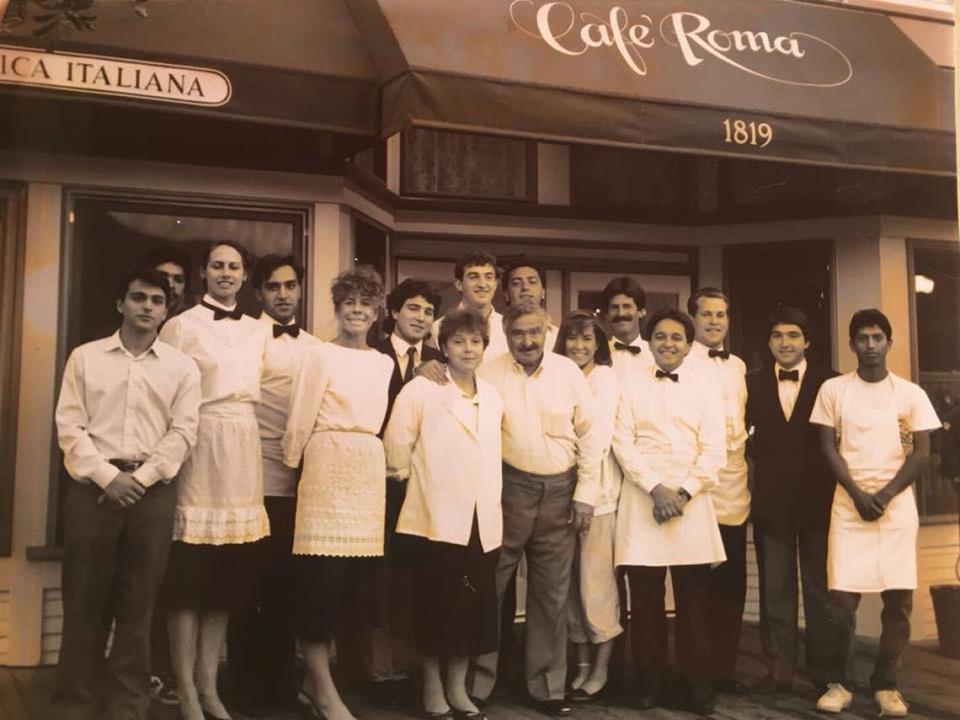 Maria Rosa and Joseph Rizzo, center, pose with their staff for a photo outside Café Roma’s original local at 1819 Osos St. in San Luis Obispo.