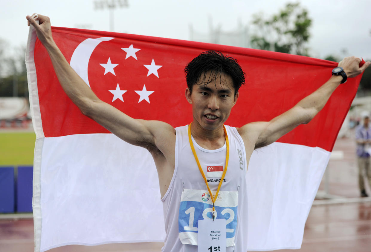 28th SEA Games Singapore 2015 - East Coast Park,  Singapore - 7/6/15   Athletics - Men's Marathon - Singapore's Guillaume Soh Rui Yong celebrates winning the marathon  SEAGAMES28 TEAMSINGAPORE  Mandatory Credit: Singapore SEA Games Organising Committee / Action Images via Reuters