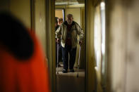 A man, fleeing from heavy shelling, boards an evacuation train at Pokrovsk train station, in Pokrovsk, eastern Ukraine, Sunday, May 22, 2022. Civilians fleeing areas near the eastern front in the war in Ukraine Sunday described scenes of devastation as their towns and villages came under sustained attack from Russian forces. (AP Photo/Francisco Seco)