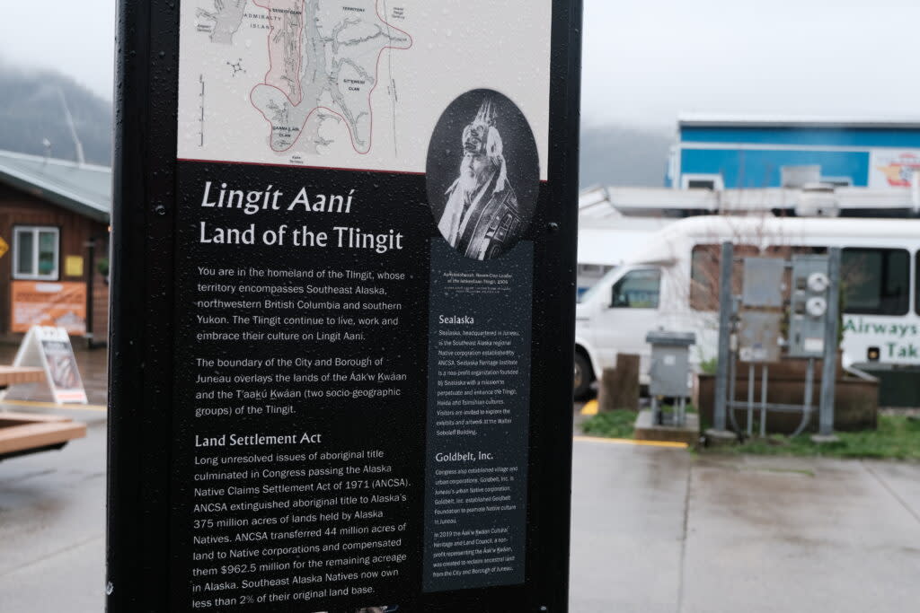 A sign in downtown Juneau informs readers that the land is called Lingít Aaní, or the land of the Tlingít people on May 7, 2024. In 2018, Gov. Bill Walker signed A.O. 300, which recognizes a linguistic emergency for Alaska Native languages, which was a recommendation of the Council for Alaska Native Languages. It promotes, among other efforts, the use of Alaska Native place names in signage. (Photo by Claire Stremple/Alaska Beacon)